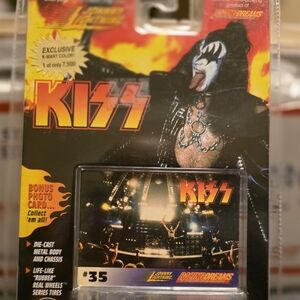 Kiss Action Figure Packaging with Black, Yellow & Red Artwork